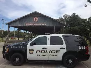Police SUV in front of a pavilion