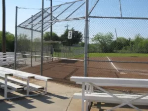 bleachers in front of a baseball diamond